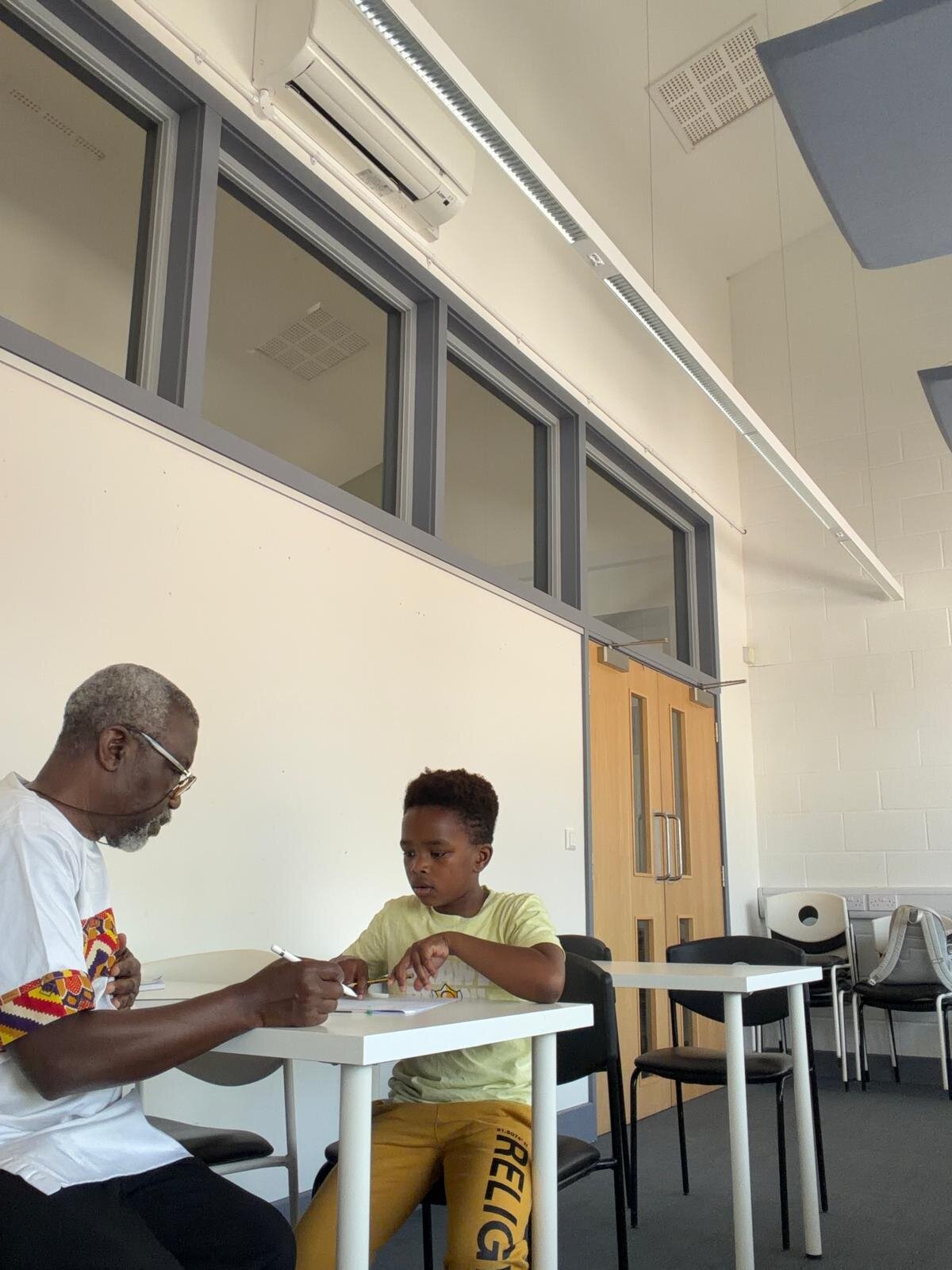 Sylvester Peprah, Lead Tutor at MathsWITHPEPS, tutoring a young student one-to-one